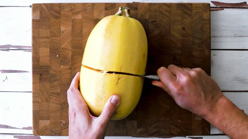 How to cut spaghetti squash: use a small sharp pairing knife to cut width-wise